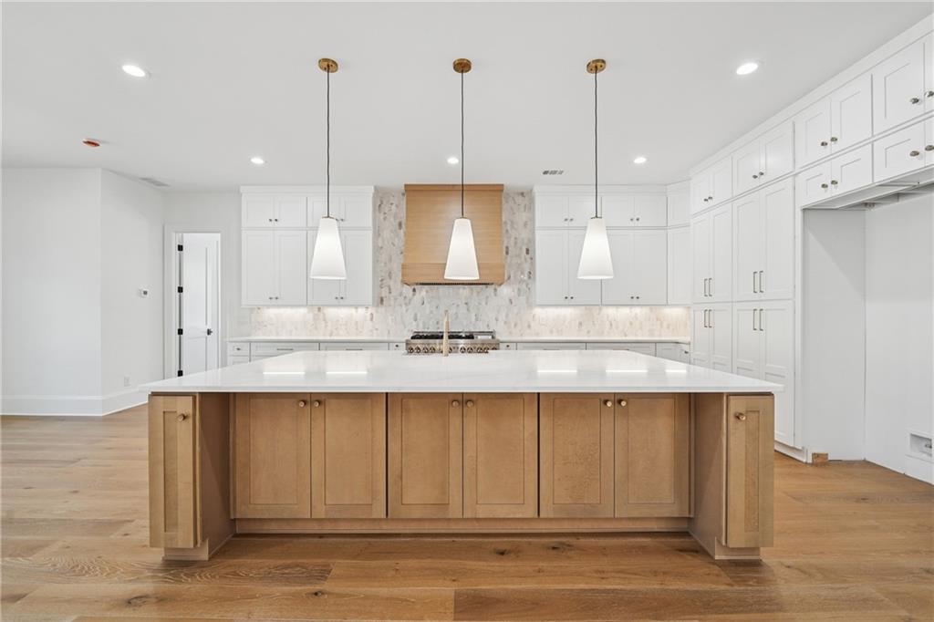 3315 Bold Springs Road Dacula, GA 30019 - Photo 9 of 63 a view of a kitchen with kitchen island sink stainless steel appliances and cabinets
