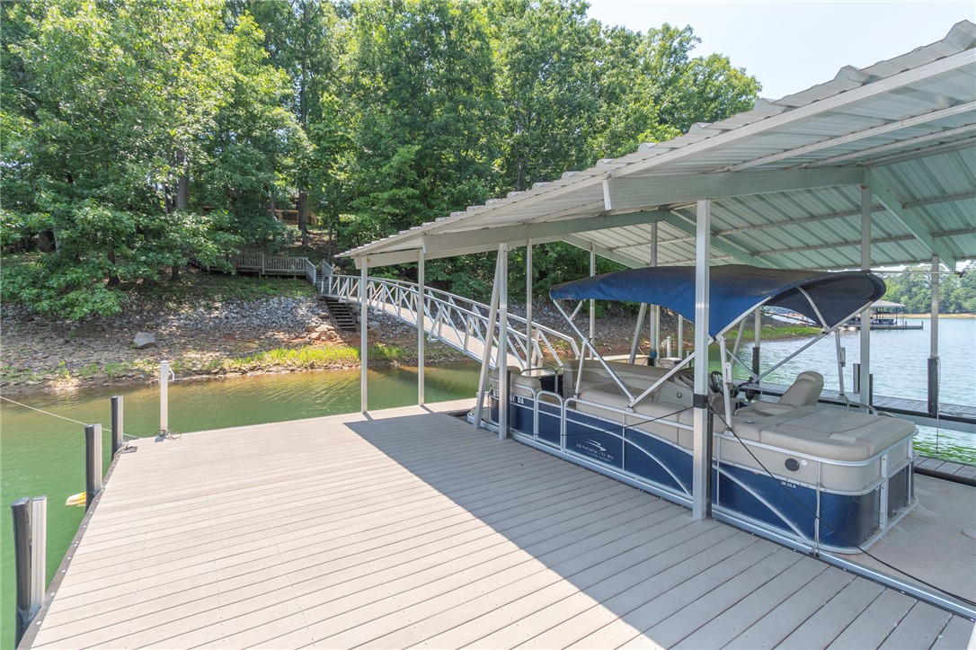 202 Plantation Point Anderson, SC 29625 - Photo 48 of 48 Boasting a private boat dock with covered slip, this waterfront property provides direct lake access.
