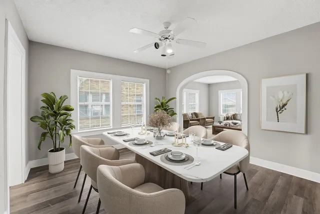 a view of a dining room with furniture window and wooden floor