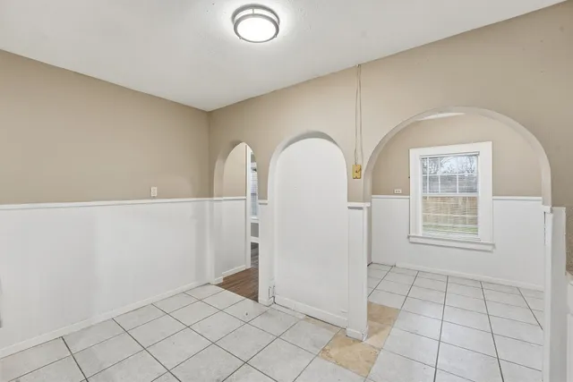 a view of empty room with windows