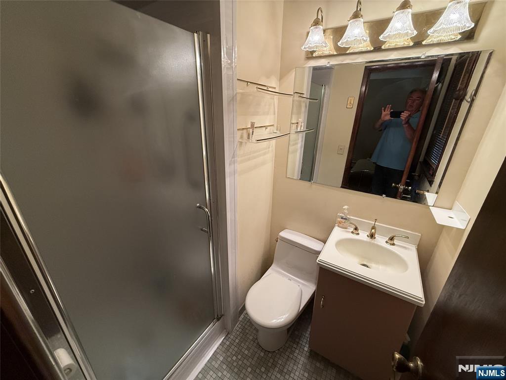 36 Lavina Trail Oak Ridge, NJ 07438 - Photo 21 of 26 a white toilet sitting next to a bathroom sink