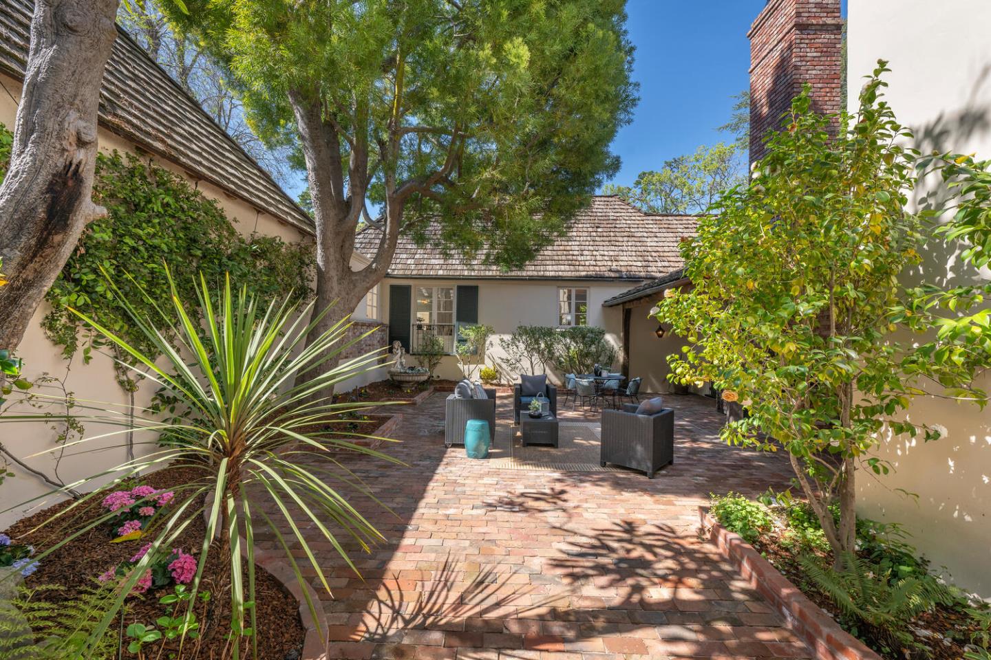 841 Hayne Road Hillsborough, CA 94010 - Photo 12 of 78 a view of patio with table and chairs and potted plants