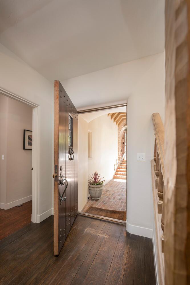 841 Hayne Road Hillsborough, CA 94010 - Photo 18 of 78 a view of a room that has a bed wooden floor and door