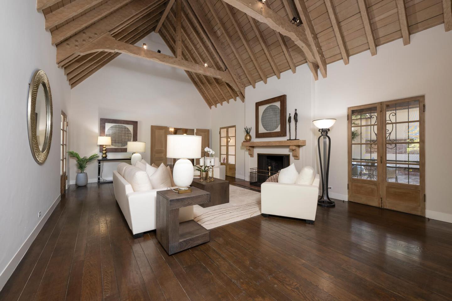 841 Hayne Road Hillsborough, CA 94010 - Photo 22 of 78 a living room with fireplace furniture and a wooden floor