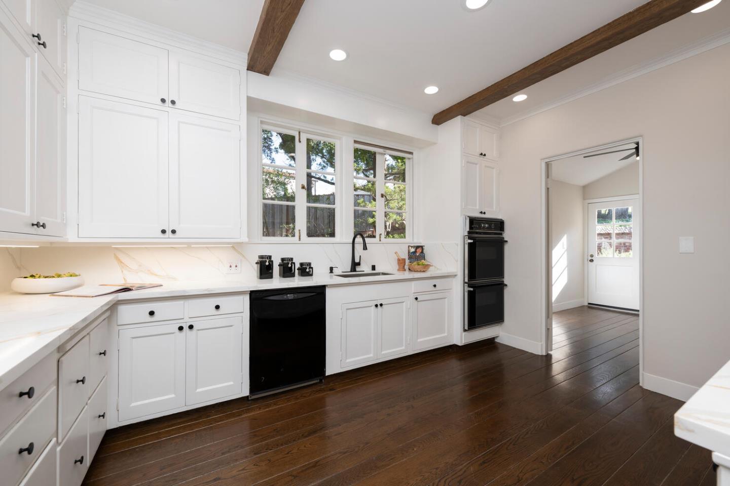 841 Hayne Road Hillsborough, CA 94010 - Photo 31 of 78 a large white kitchen with granite countertop a large counter top space a sink stainless steel appliances and cabinets