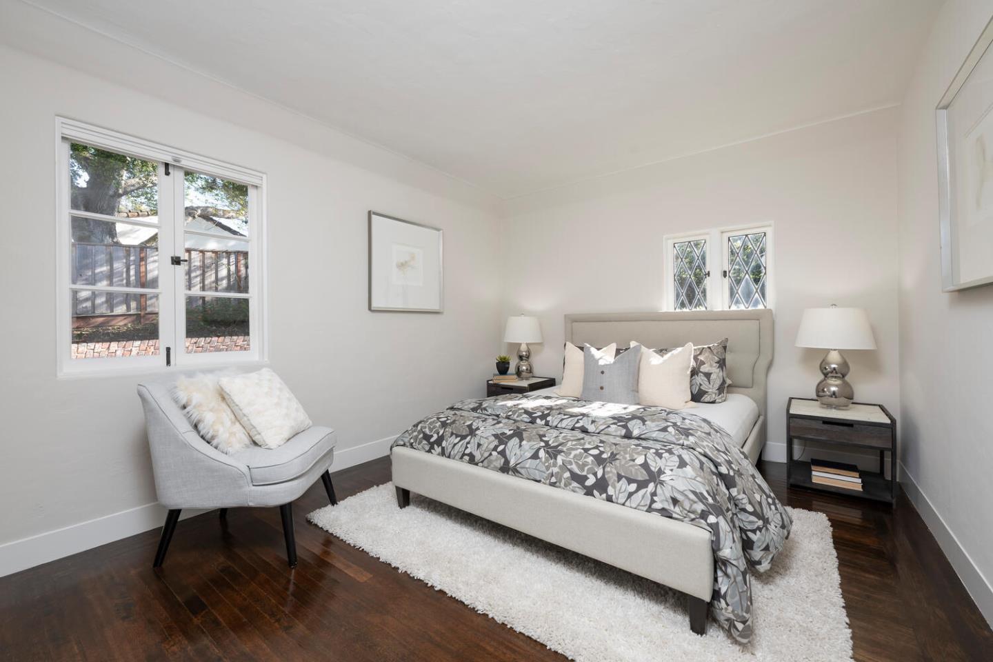 841 Hayne Road Hillsborough, CA 94010 - Photo 39 of 78 a bedroom with a bed a couch and painting on the wall