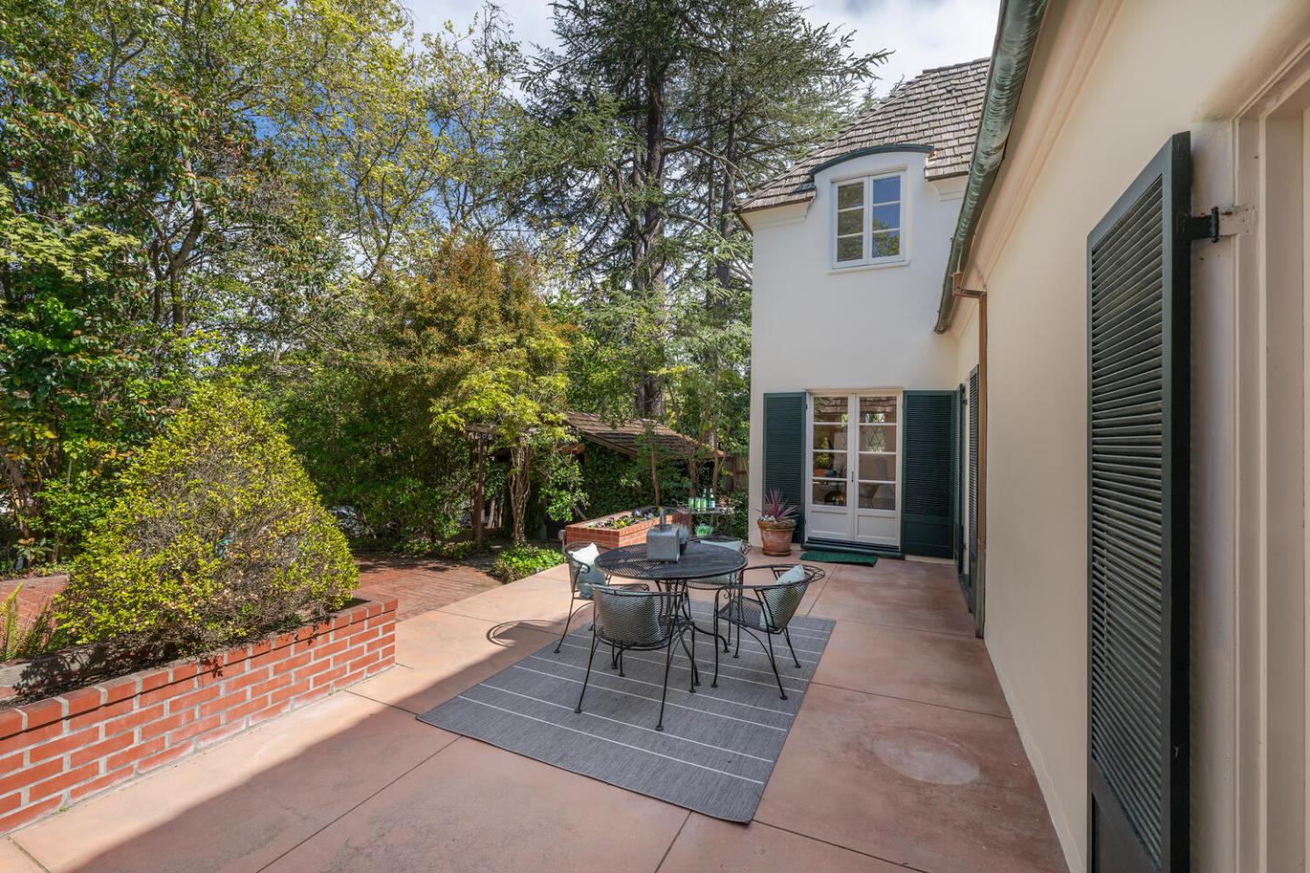 841 Hayne Road Hillsborough, CA 94010 - Photo 60 of 78 a view of a patio with table and chairs and potted plants
