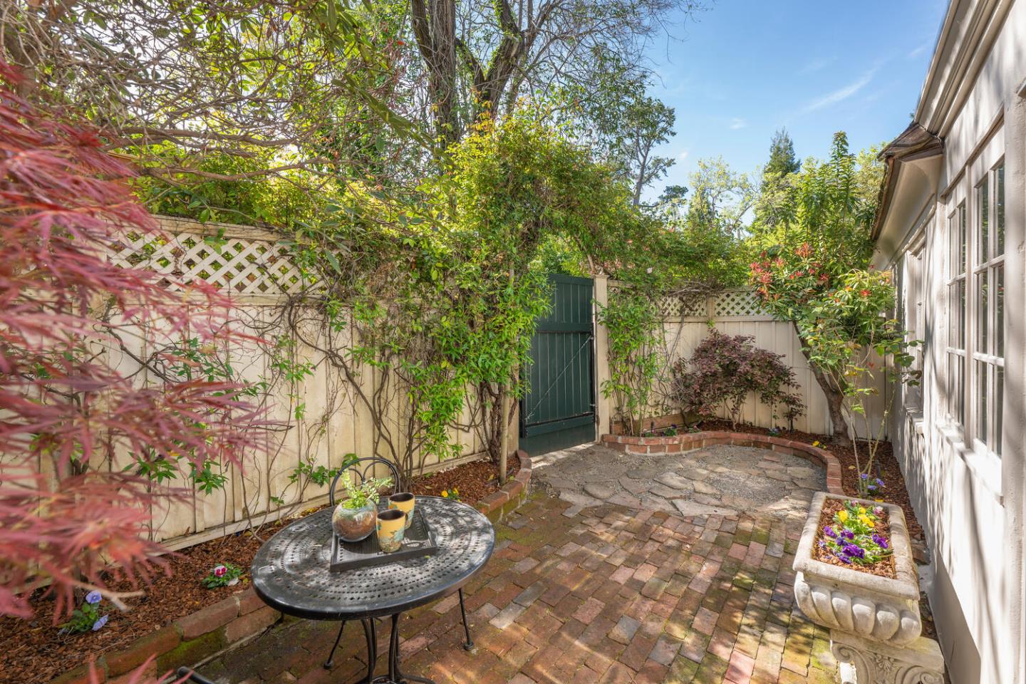 841 Hayne Road Hillsborough, CA 94010 - Photo 64 of 78 a view of a patio with table and chairs and potted plants