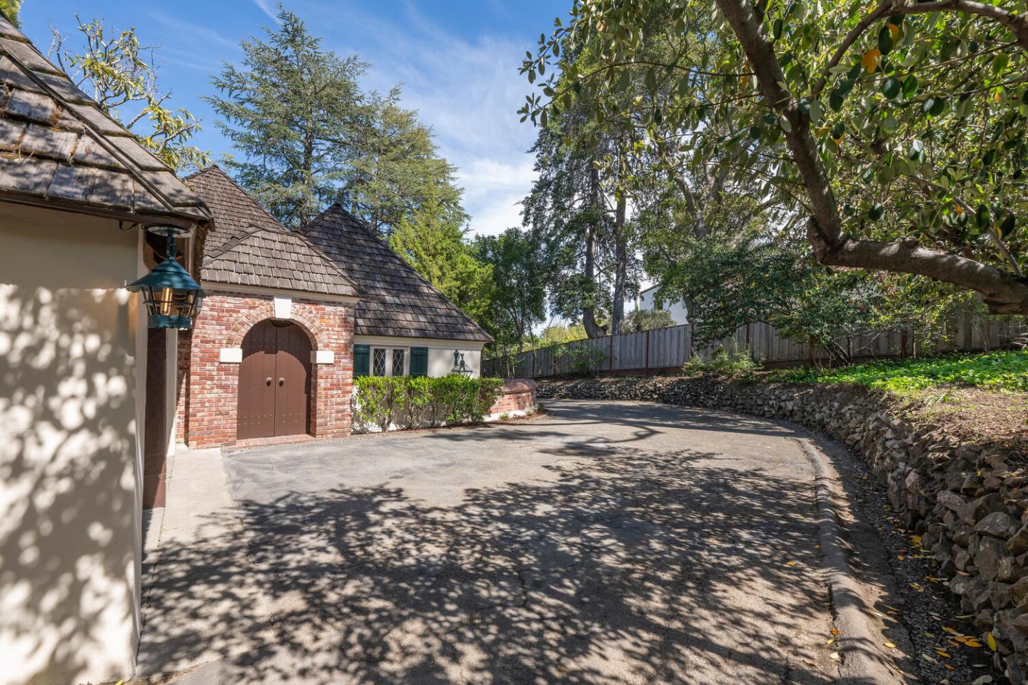 841 Hayne Road Hillsborough, CA 94010 - Photo 9 of 78 a front view of a house with a yard and garage