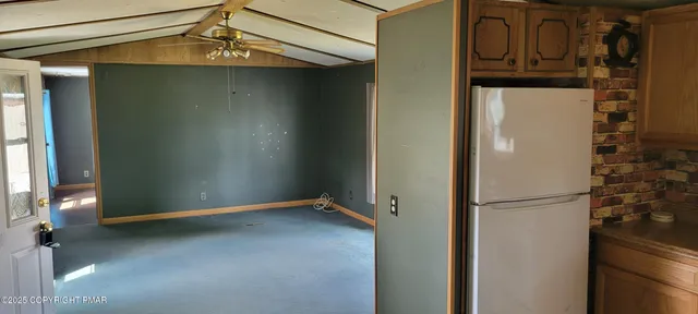 a bedroom with a bed a lamp and a chandelier