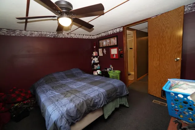 a kitchen with a refrigerator and cabinets