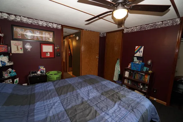 a kitchen with a sink appliances cabinets and a window