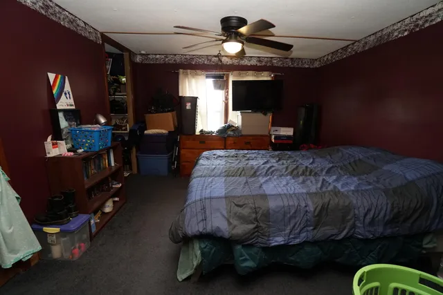 a kitchen with a refrigerator and a stove