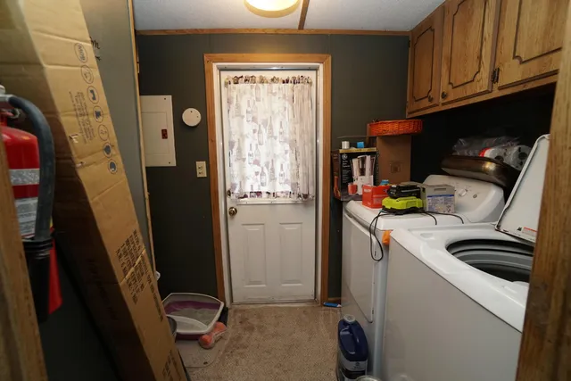 a kitchen with sink refrigerator and stove