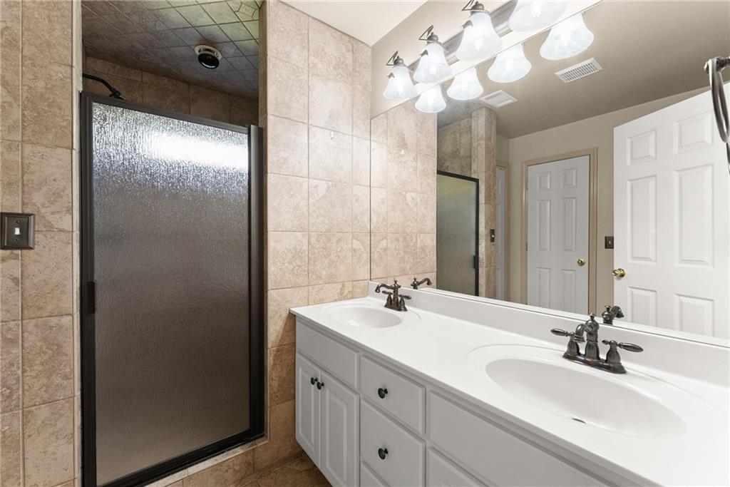 3454 Highway 254 Cleveland, GA 30528 - Photo 19 of 52 a bathroom with a double vanity sink and a mirror