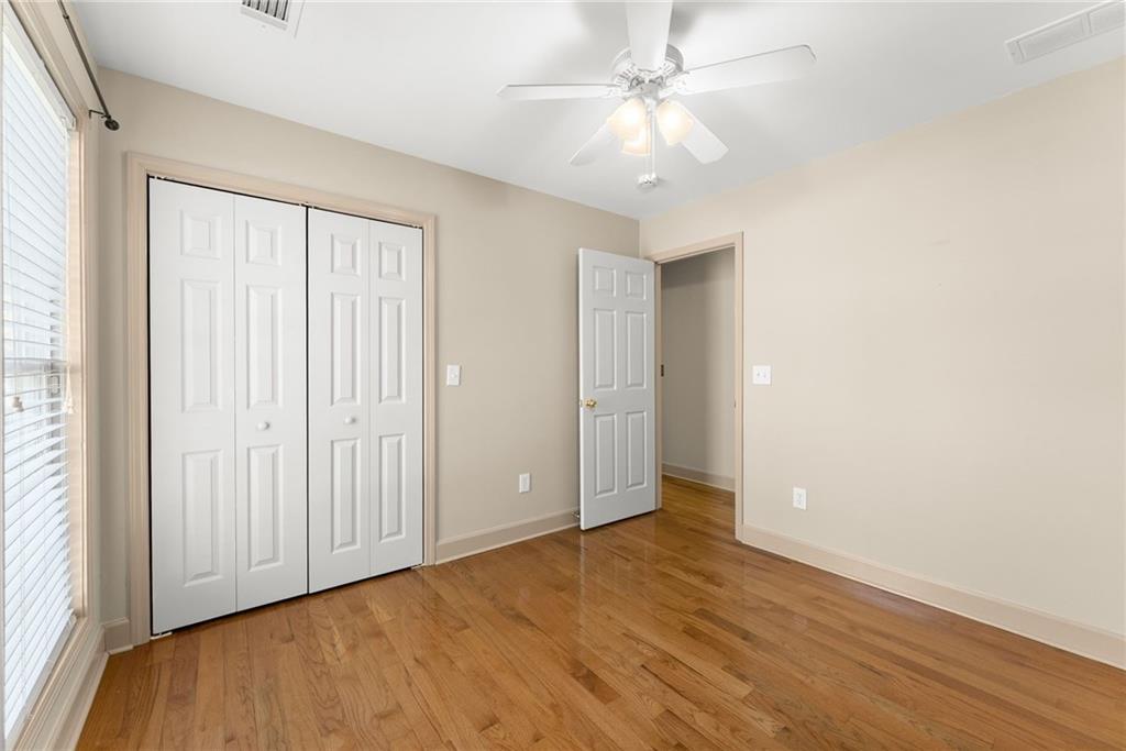 3454 Highway 254 Cleveland, GA 30528 - Photo 24 of 52 an empty room with wooden floor fan and windows