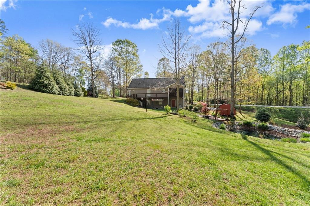 3454 Highway 254 Cleveland, GA 30528 - Photo 38 of 52 a view of an house with backyard space and balcony