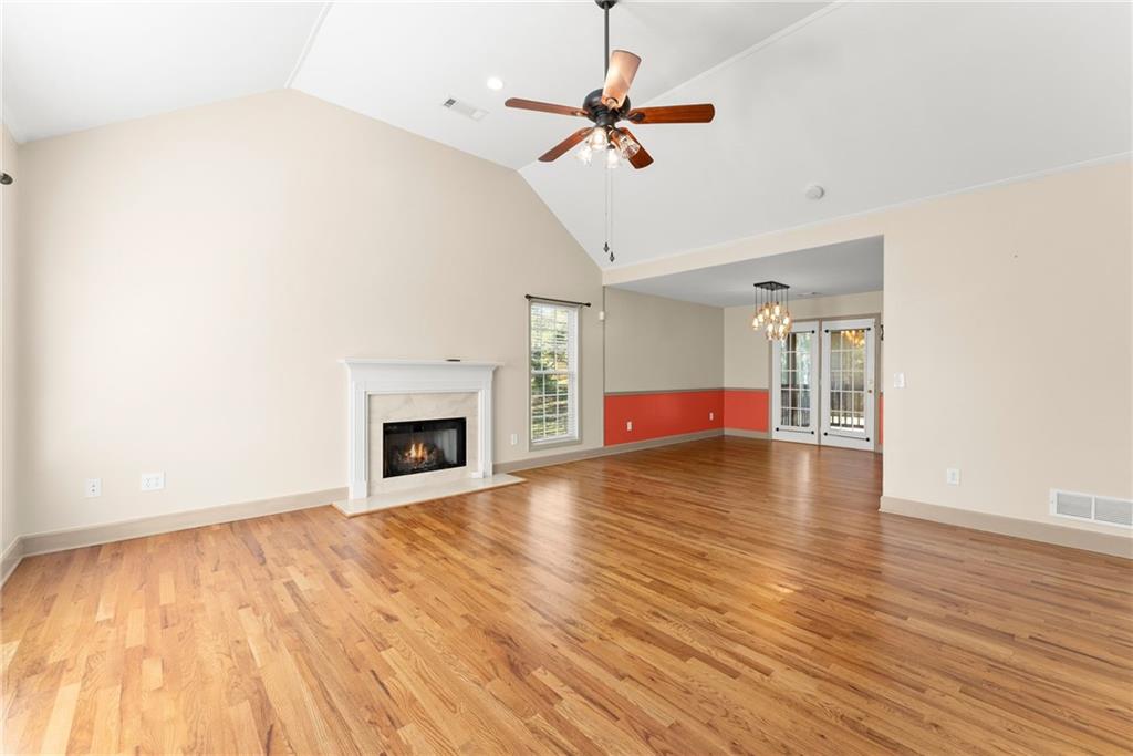 3454 Highway 254 Cleveland, GA 30528 - Photo 4 of 52 a view of empty room with wooden floor and fireplace