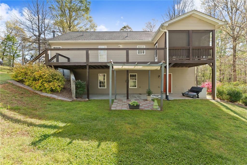 3454 Highway 254 Cleveland, GA 30528 - Photo 41 of 52 a front view of a house with a yard and garage