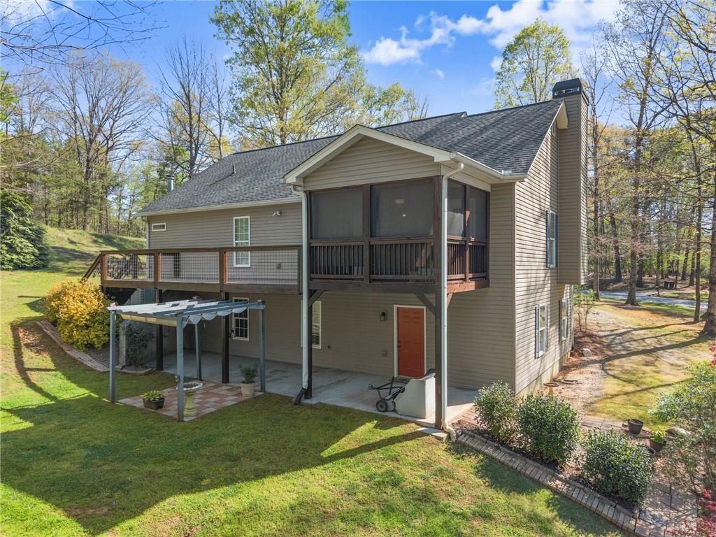 3454 Highway 254 Cleveland, GA 30528 - Photo 42 of 52 a view of a house with backyard porch and sitting area