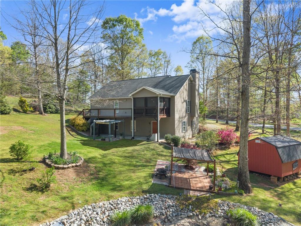 3454 Highway 254 Cleveland, GA 30528 - Photo 43 of 52 a front view of a house with swimming pool table and chairs