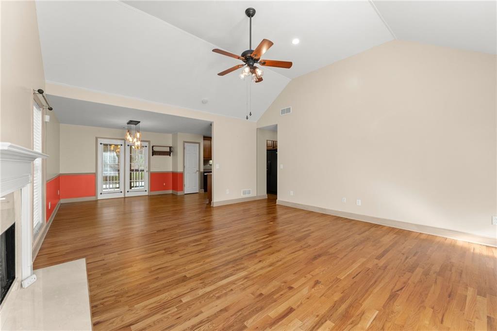 3454 Highway 254 Cleveland, GA 30528 - Photo 6 of 52 a view of a livingroom with wooden floor and a ceiling fan