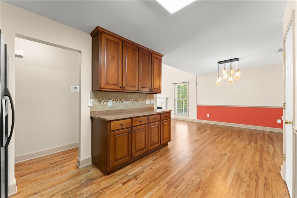 3454 Highway 254 Cleveland, GA 30528 - Photo 9 of 52 a view of kitchen with granite countertop cabinets and wooden floor