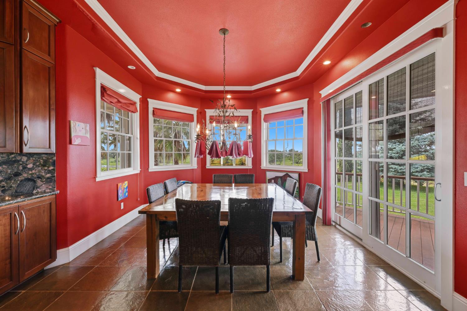 10120 Shenandoah Road Plymouth, CA 95669 - Photo 29 of 86 a view of a dining room with furniture large windows and wooden floor