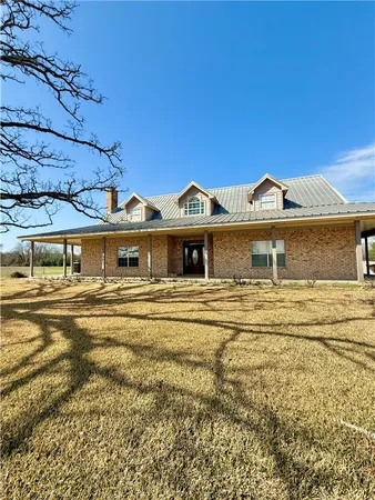 a front view of a house with a ocean view