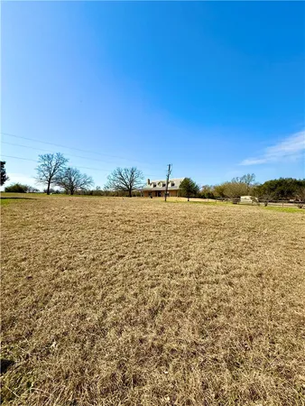 a view of a road with a yard