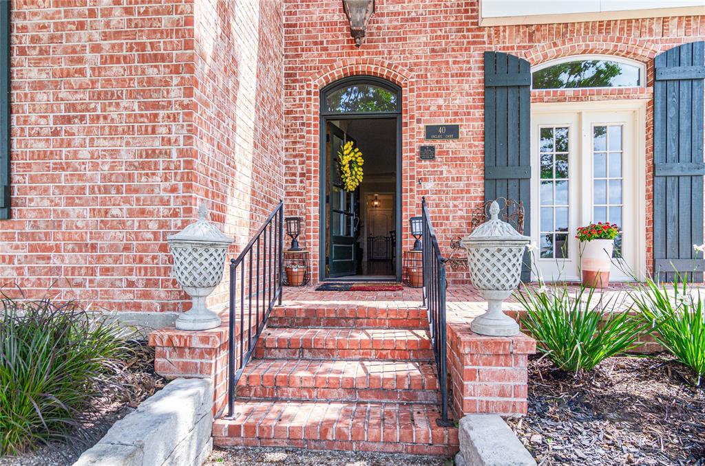 40 Enclave Court Waco, TX 76708 - Photo 2 of 40 a front view of a house with a garden
