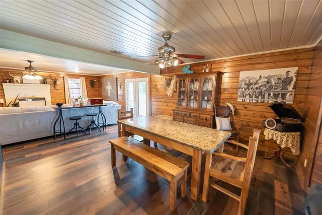 a outdoor space with lots of furniture and wooden floor