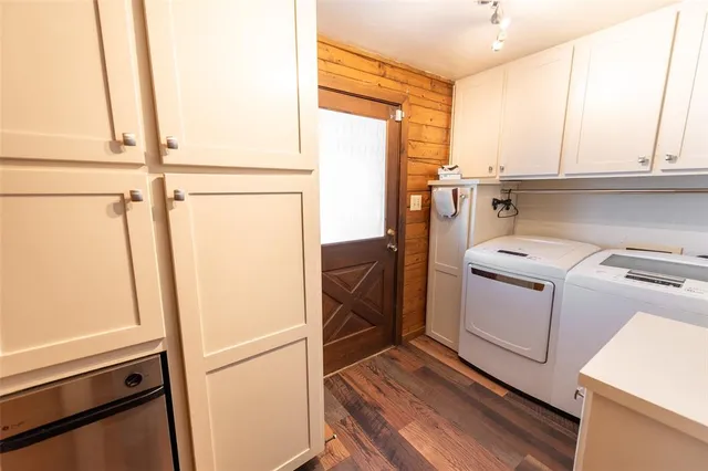 a view of storage and utility room with washer and dryer