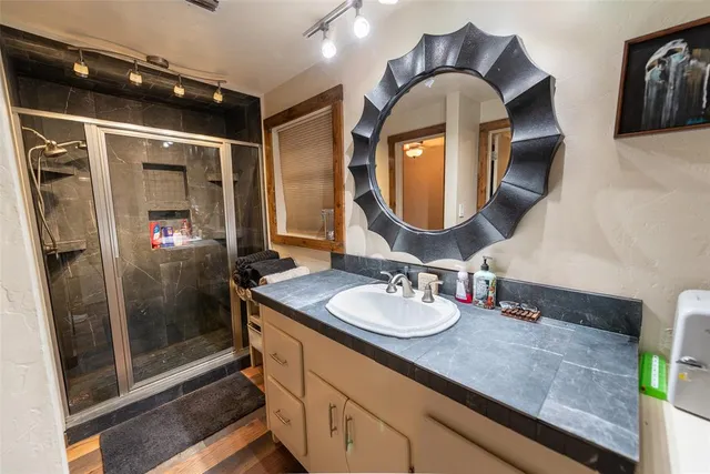 a bathroom with a sink and a mirror