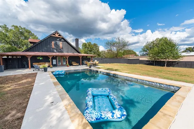 a view of a house with swimming pool