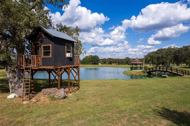 a view of a lake with a house in the background