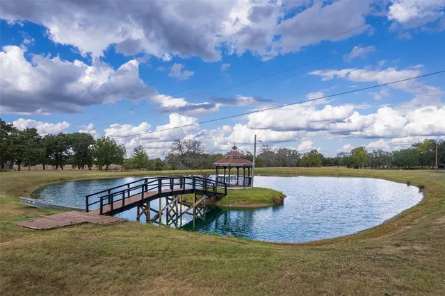 a view of a lake with houses in the back