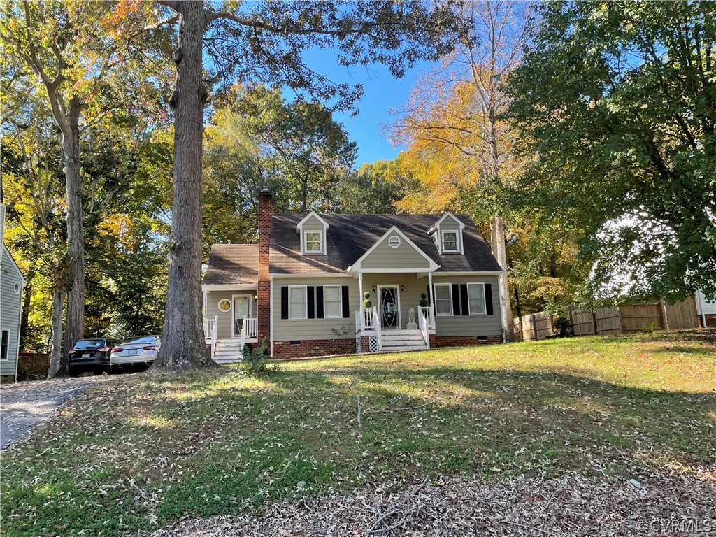 4936 Tulip Oak Road Chesterfield, VA 23832 - Photo 1 of 1 a front view of a house with a garden and trees