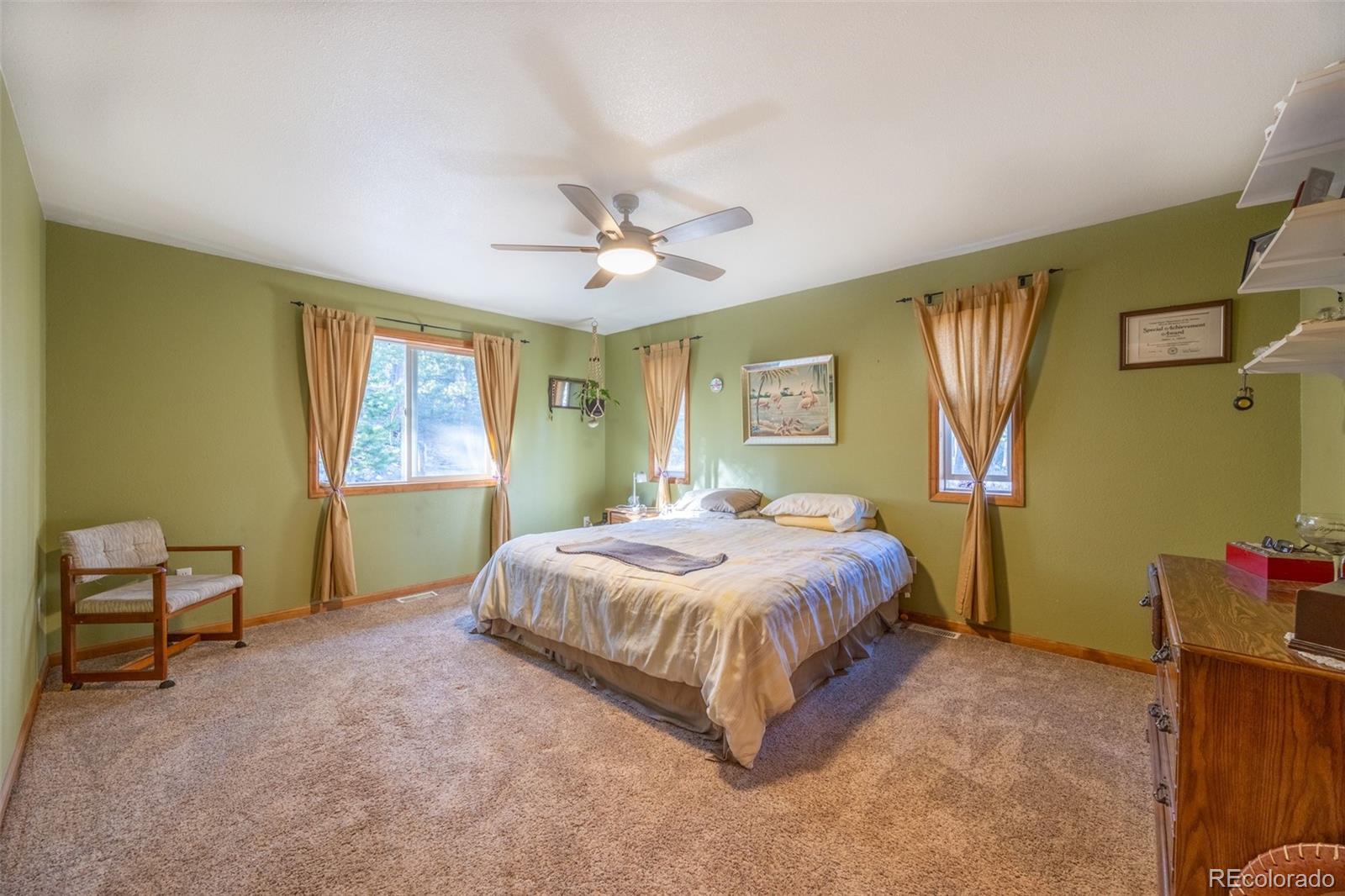 493 Caesar Road Black Hawk, CO 80422 - Photo 12 of 35 a living room with a bed furniture and a window