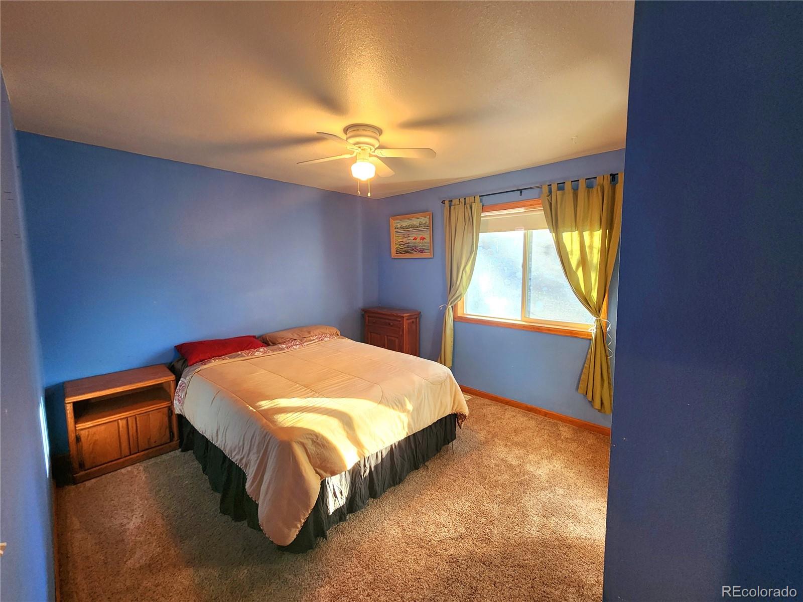 493 Caesar Road Black Hawk, CO 80422 - Photo 21 of 35 a bed sitting in a room next to a window