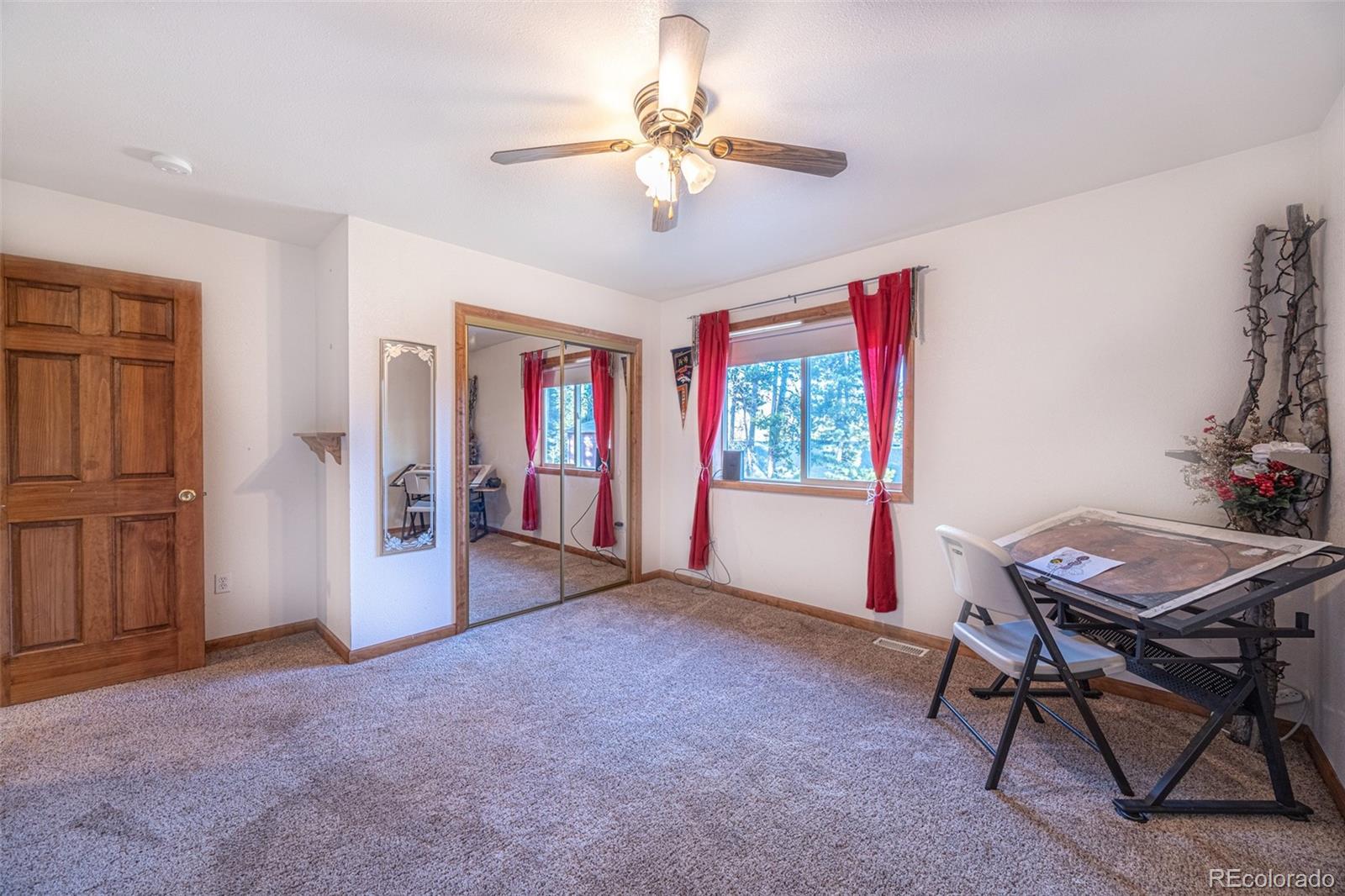 493 Caesar Road Black Hawk, CO 80422 - Photo 23 of 35 a view of a livingroom with furniture window and wooden floor