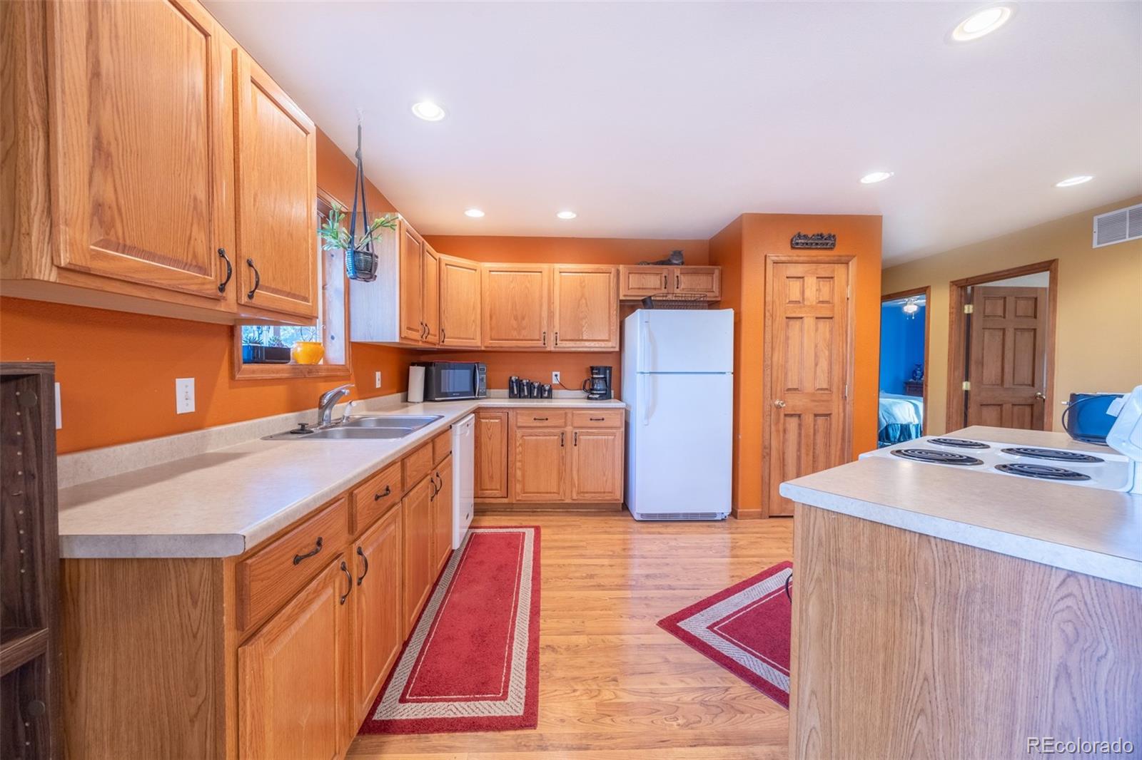 493 Caesar Road Black Hawk, CO 80422 - Photo 5 of 35 a kitchen with stainless steel appliances granite countertop a refrigerator a sink and a stove