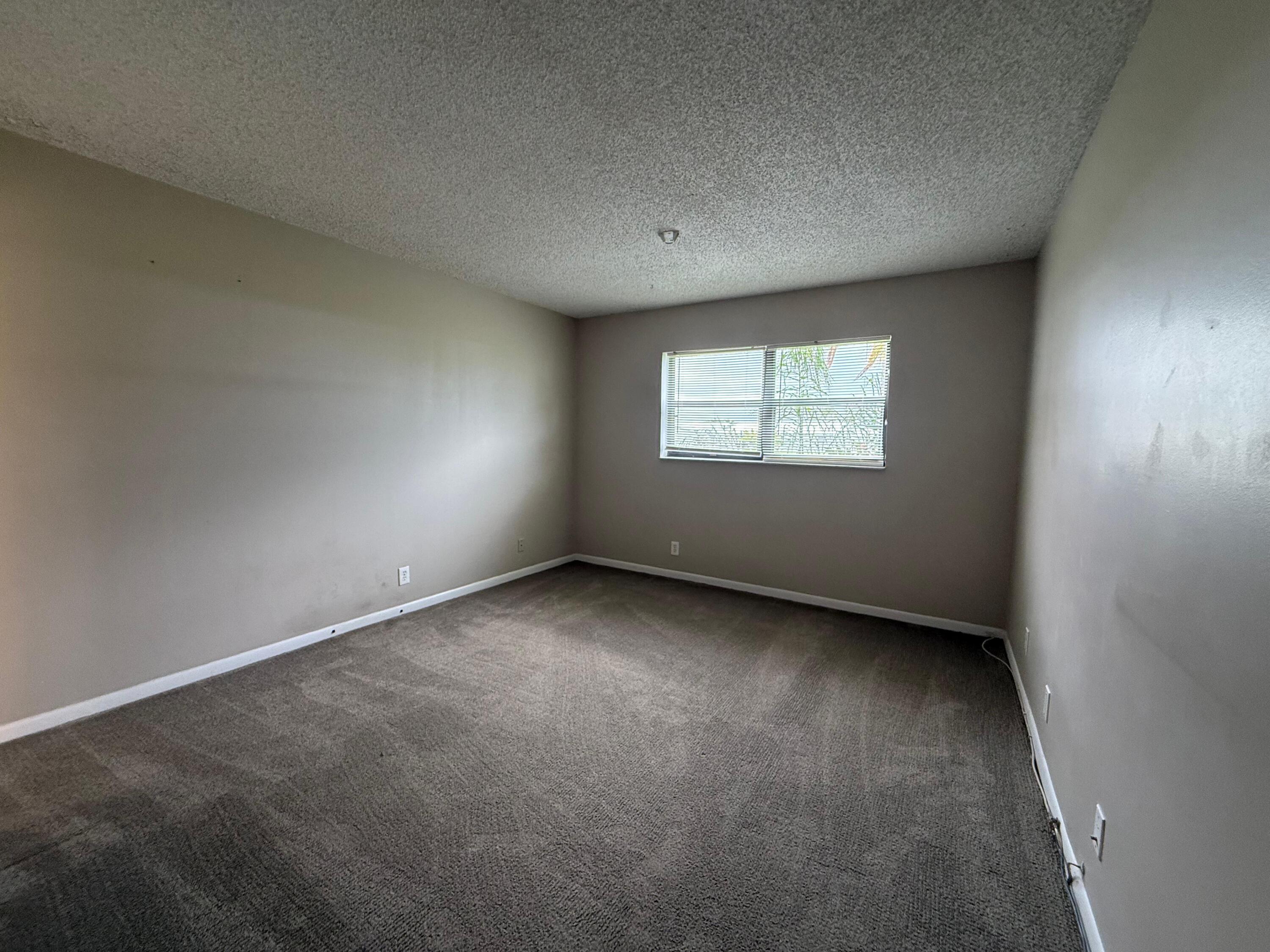 2141 Woolbright Road, Unit L106 Boynton Beach, FL 33426 - Photo 7 of 11 Primary Bedroom