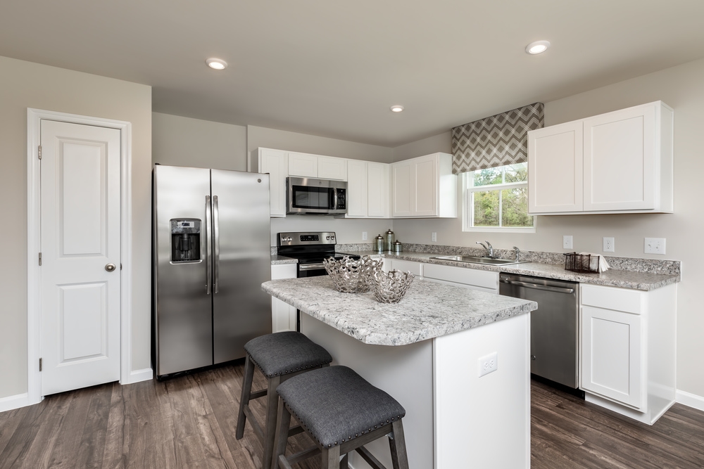 630 Wingtip Way Harrisonburg, VA 22801 - Photo 2 of 15 a kitchen with stainless steel appliances granite countertop a sink stove refrigerator and refrigerator