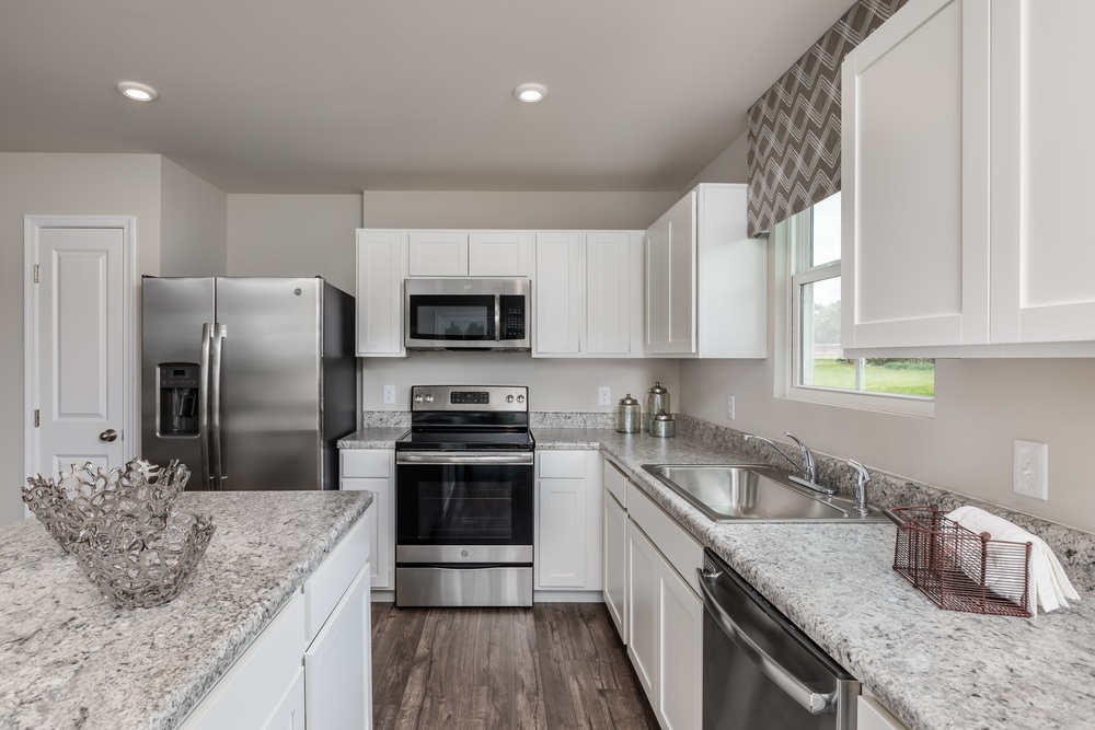 630 Wingtip Way Harrisonburg, VA 22801 - Photo 3 of 15 a kitchen with stainless steel appliances granite countertop a sink stove microwave and refrigerator