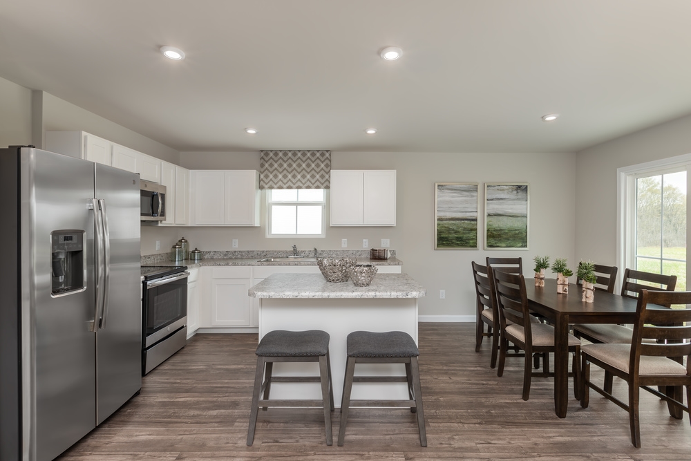 630 Wingtip Way Harrisonburg, VA 22801 - Photo 4 of 15 a kitchen with granite countertop stainless steel appliances a table and chairs in it