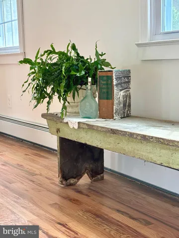 a view of a livingroom with furniture and hardwood floor