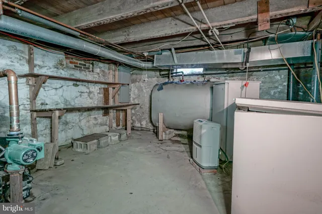 a refrigerator freezer sitting inside of a room