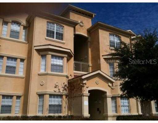 720 Terrace Ridge Circle, Unit 720 Davenport, FL 33896 - Photo 1 of 1 a front view of a house with a yard