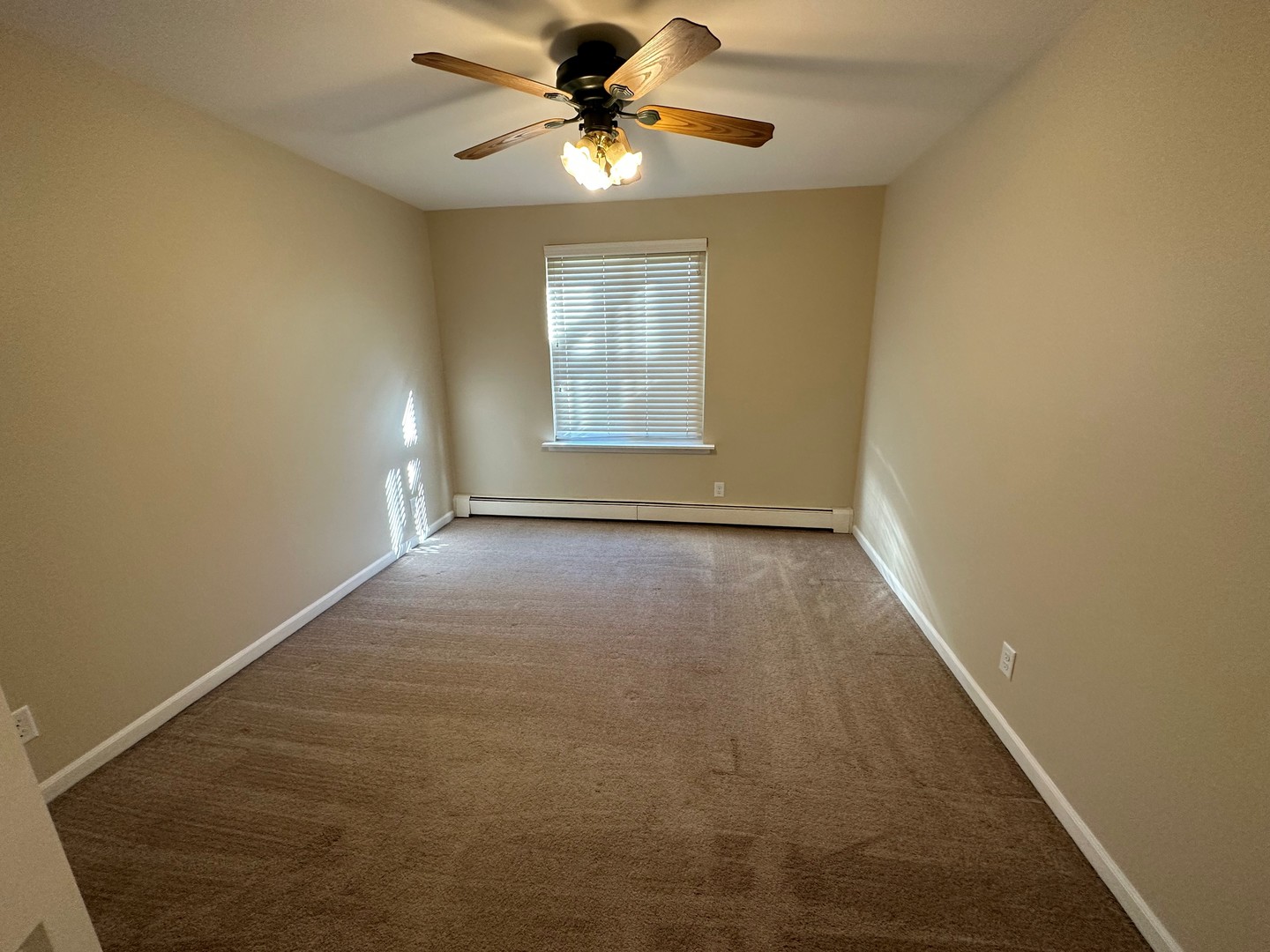 2100 Light Road, Unit 108 Oswego, IL 60543 - Photo 11 of 12 a view of room with window and a ceiling fan